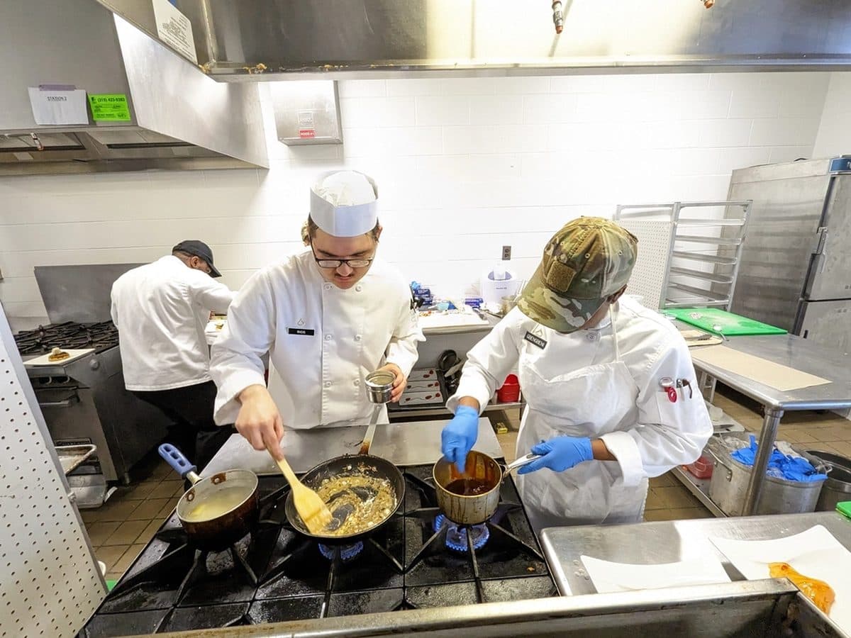 Chefs preparing service in a professional kitchen